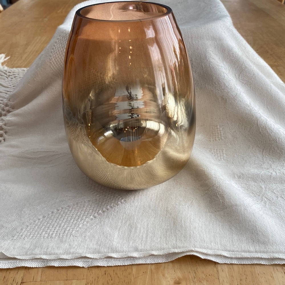 Ombreish colored vase.Orangish on top Gold on bottom Inside bottom is silver 7in